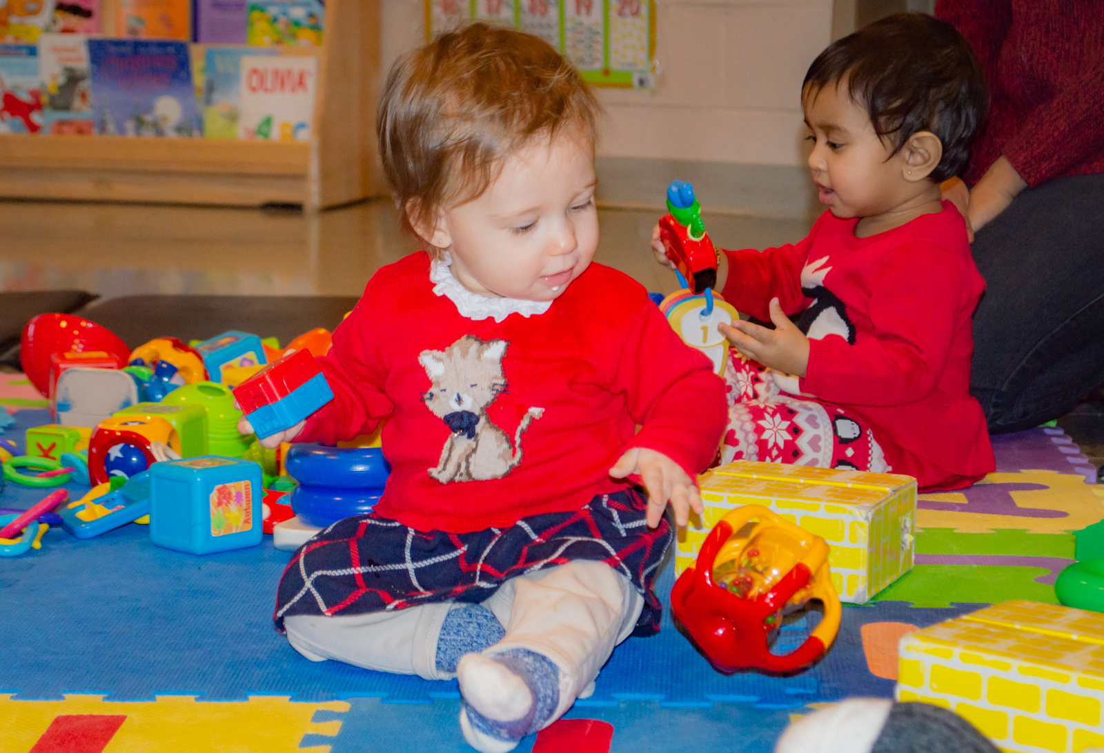 Children playing together during an EarlyON family program